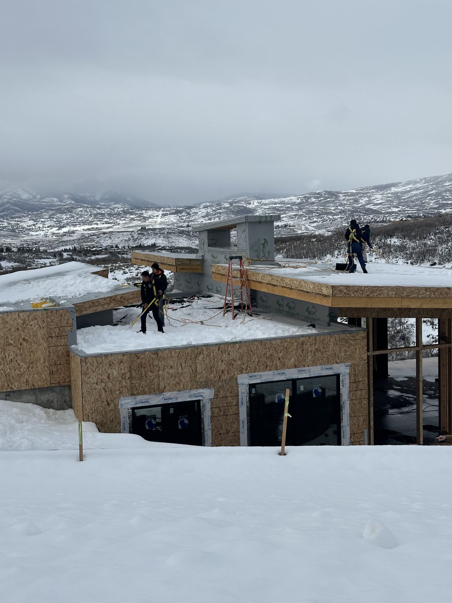 Roof snow removal on a Park City home